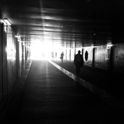 Woman walking in tunnel