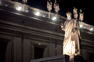 Low angle view of illuminated statue at night