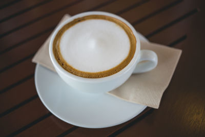 High angle view of cappuccino on table