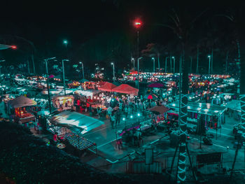 High angle view of illuminated market in city at night