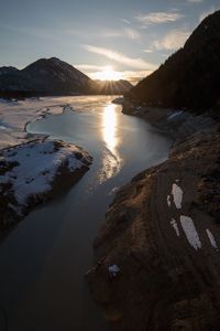 Scenic view of lake at sunset