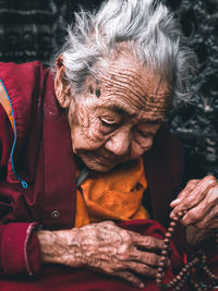 Portrait of woman sitting outdoors