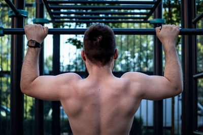 Rear view of shirtless man