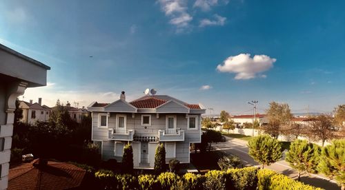 Houses and buildings against sky