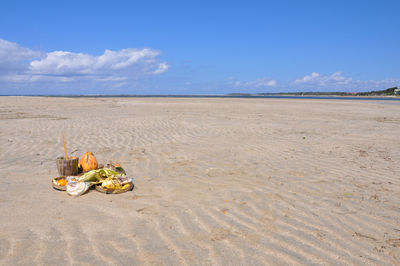 Abandoned sand on beach against sky