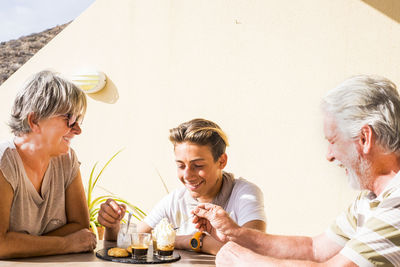 Family having dessert while sitting at table