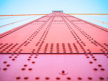 Low angle view of metallic structure against sky