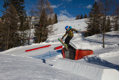 Person skiing on snow covered mountain