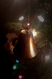 Low angle view of light bulb hanging from ceiling