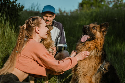 Active family, fitness couple, pet love, dog training, best dog breeds for family. 