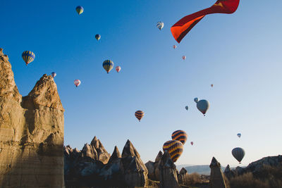 Low angle view of hot air balloons against sky