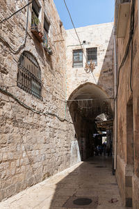 Narrow alley amidst buildings in city