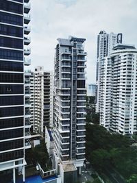 Buildings in city against sky