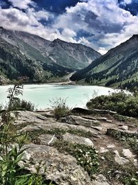 Scenic view of lake and mountains against sky