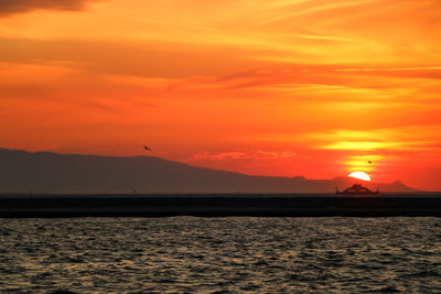 Scenic view of sea at sunset