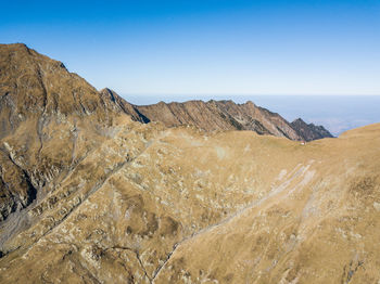 Aerial view of mountains against sky