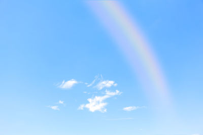 Low angle view of rainbow in sky