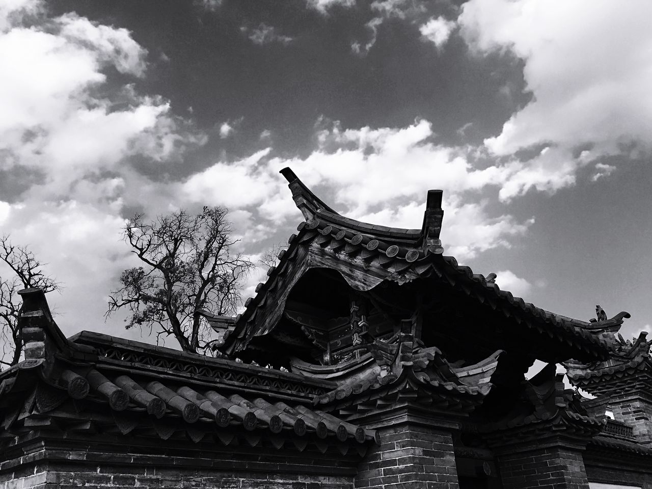 architecture, built structure, low angle view, place of worship, religion, sky, spirituality, building exterior, temple - building, history, cloud - sky, famous place, travel destinations, temple, cloud, travel, tourism, cultures