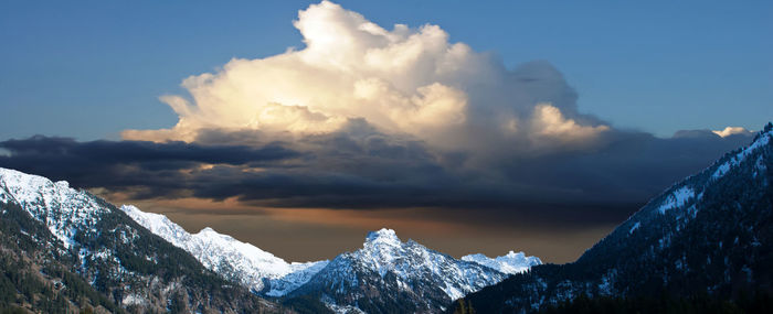 Scenic view of snowcapped mountains against sky