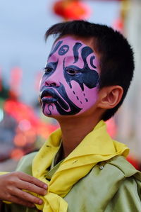 Close-up of boy wearing carnival costume