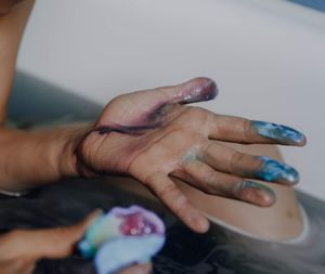 High angle view of woman hands on table