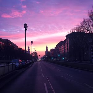 Street against sky at sunset