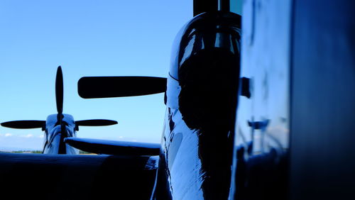 Close-up of ship against blue sky