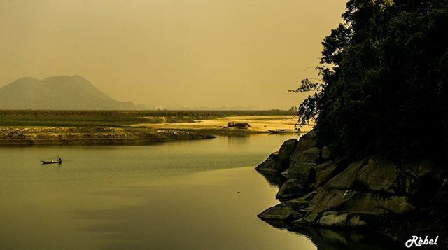 water, tranquil scene, tranquility, scenics, beauty in nature, sunset, waterfront, clear sky, reflection, nautical vessel, copy space, lake, nature, boat, transportation, idyllic, sea, calm, silhouette, river