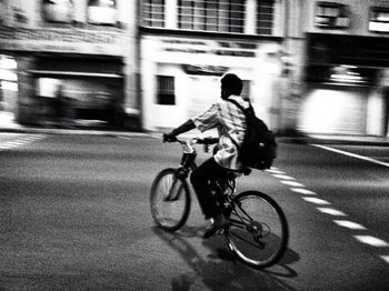 Man riding bicycle on road