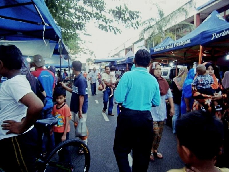 large group of people, lifestyles, transportation, men, leisure activity, mode of transport, person, street, travel, mixed age range, casual clothing, land vehicle, city life, medium group of people, day, walking, on the move, crowd, city