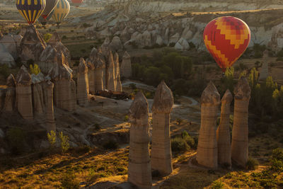 View of hot air balloons in temple against building