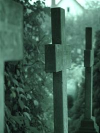 Close-up of cross at cemetery