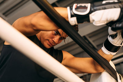 Man looking down in boxing ring