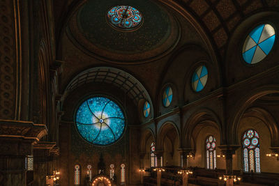 Low angle view of illuminated glass window in synagogue 