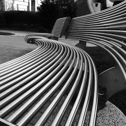 Close-up of patterned bench in park