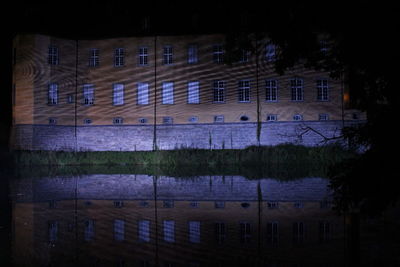 Reflection of illuminated buildings in water