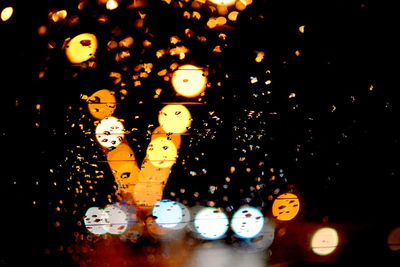 Close-up of illuminated lights at night