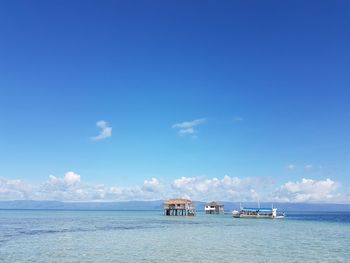 Scenic view of sea against blue sky