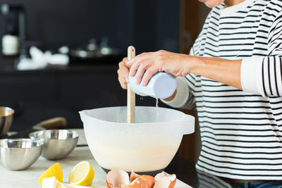 Midsection of woman preparing food