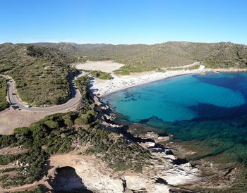 High angle view of land against clear blue sky