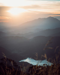 Scenic view of mountains against sky during sunset