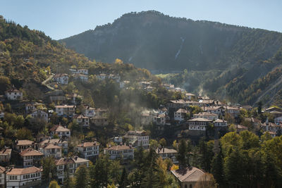 High angle view of trees and mountains against clear sky