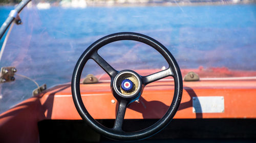 Close-up of steering wheel in boat