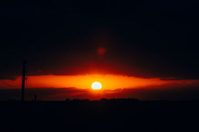 Scenic view of silhouette landscape against romantic sky at sunset