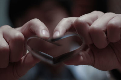 Close-up of hands holding heart shape