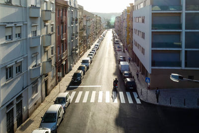 High angle view of cars parked on street in city