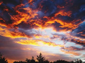 Low angle view of dramatic sky during sunset