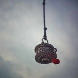 Low angle view of hanging against sky