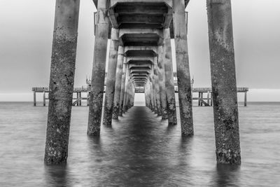 Pier over sea against sky