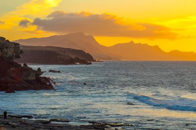 Scenic view of sea against sky during sunset